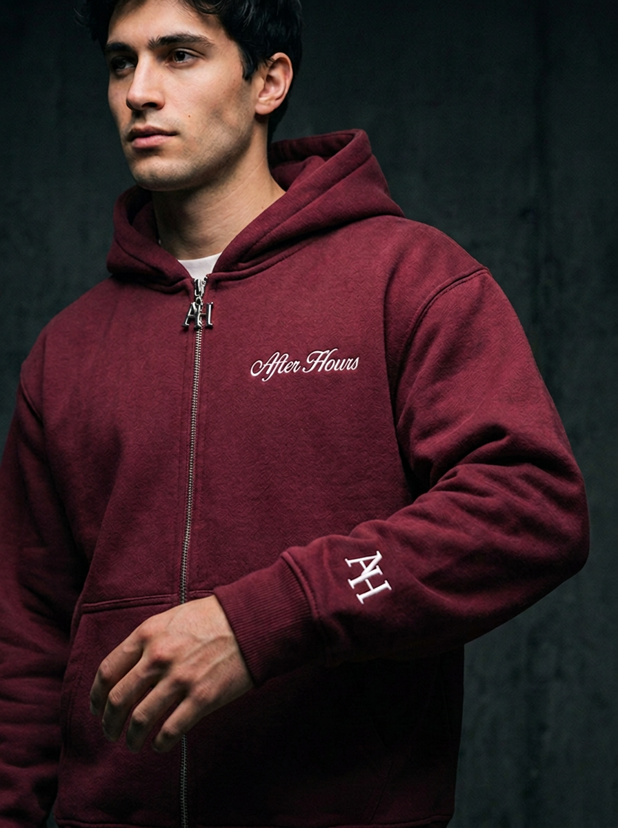 Close-up of the maroon After Hours hoodie embroidery, zip pull and heavyweight fleece